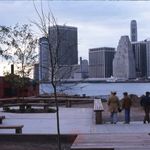 "Skyline view of Manhattan from new park deck at Fulton Ferry Landing. Includes construction equipment and downtown Manhattan."